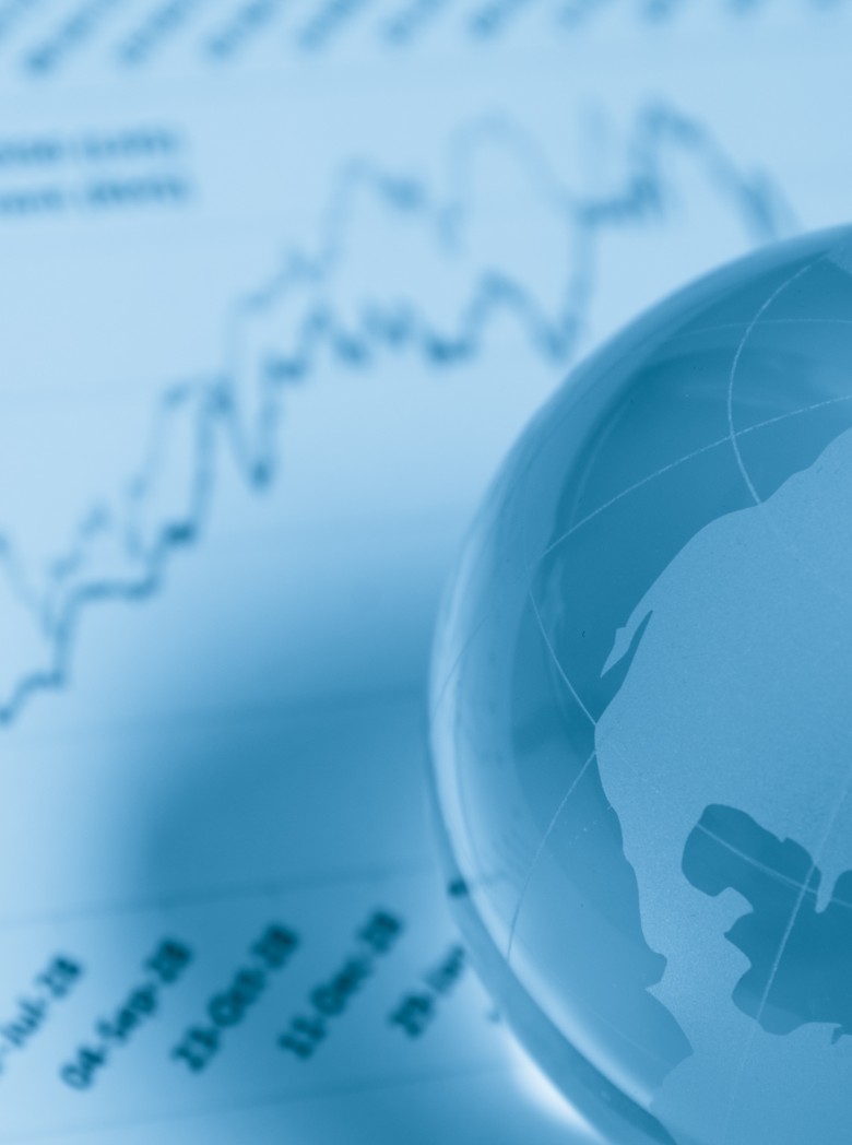 Globe and a graph sitting on a desk
